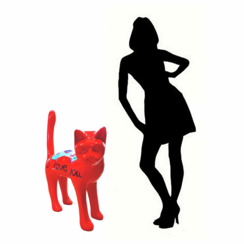 Silhouette of a person in a dress and heels next to a red cat figurine with the words