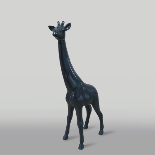 Statue of a black giraffe on a grey background.