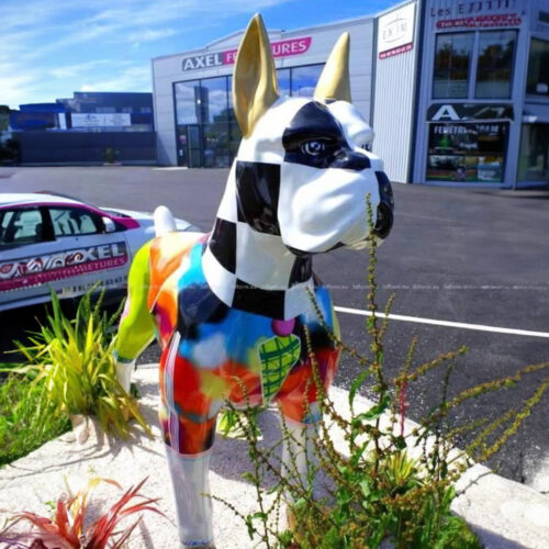 Colorful dog statue in front of a commercial building with