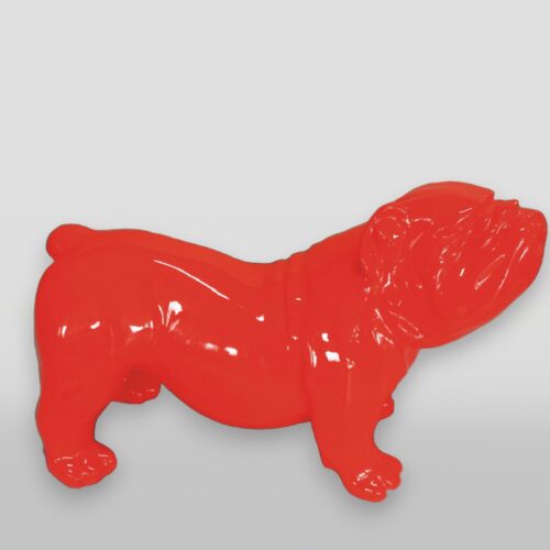 Bright red ceramic bulldog figure on a light gray background.