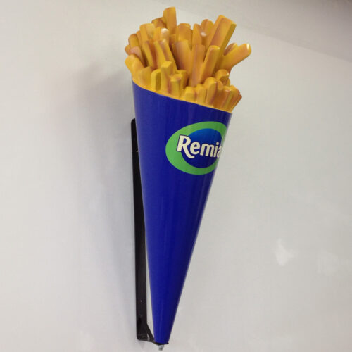 Large cone filled with mock French fries, attached to a wall with the brand name