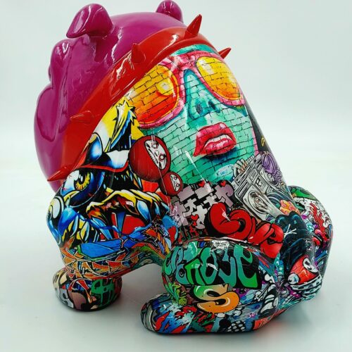 Colorful graffiti-style sculpted figure with a horned helmet and vibrant street art designs, including abstract patterns and faces, covering its entire body.