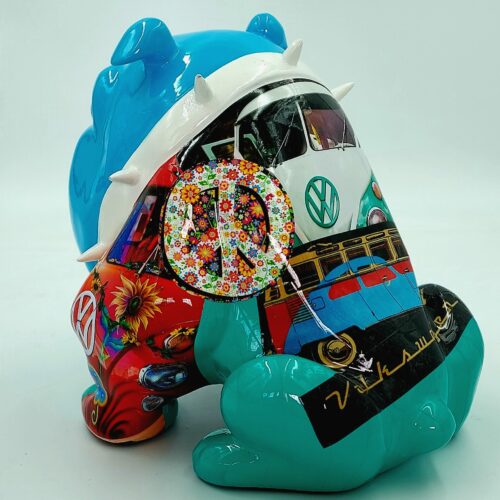 Colorful sculpture of a cartoonish bear with a design featuring a retro Volkswagen van and a floral peace sign.
