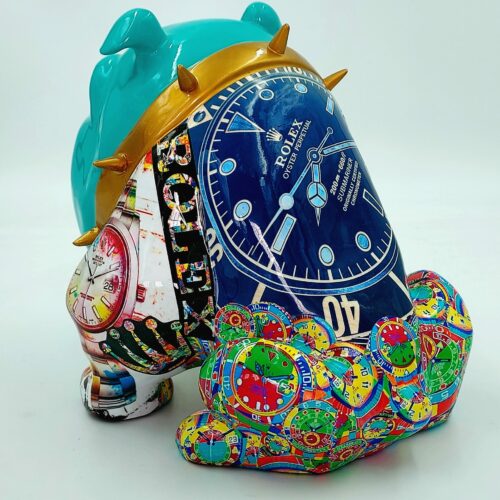 A colorful sculpture of a dog adorned with various watch designs and motifs, including a prominent blue Rolex watch face with a gold spiked collar.