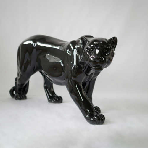 A shiny black ceramic sculpture of a panther in a walking pose, set against a plain white background.