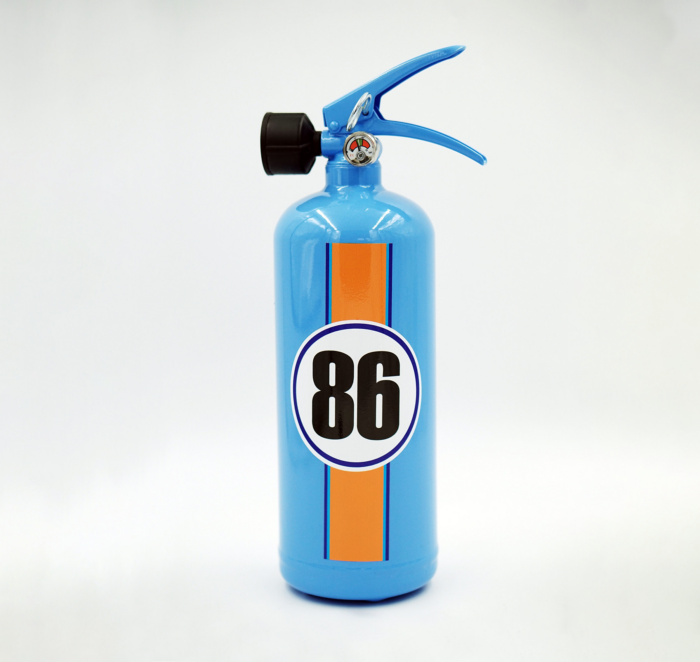 Blue fire extinguisher with an orange stripe and the number 86 on the front.