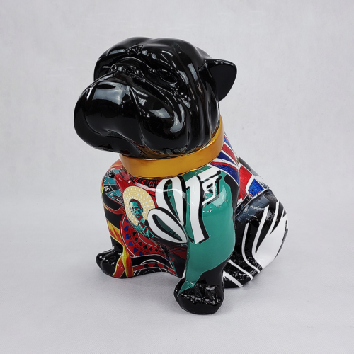 A sculpture of a bulldog with a black head and colorful, patterned body, including elements like green, red, and Union Jack designs.