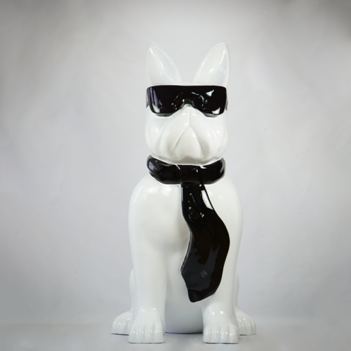 Ceramic sculpture of a dog wearing sunglasses and a tie.