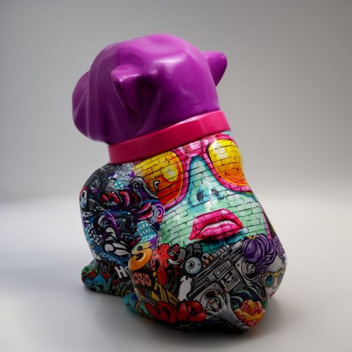 Colorful bulldog statue with a purple head and a body covered in various graffiti-style art and patterns.