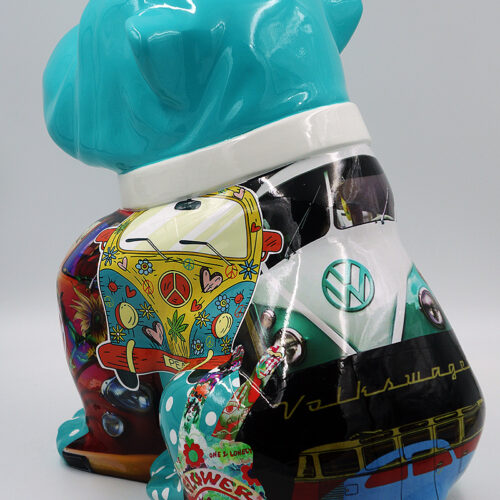 Colorful sculpture of a dog with a turquoise head and vibrant, patterned body featuring images of flowers, peace symbols, and Volkswagen vans.