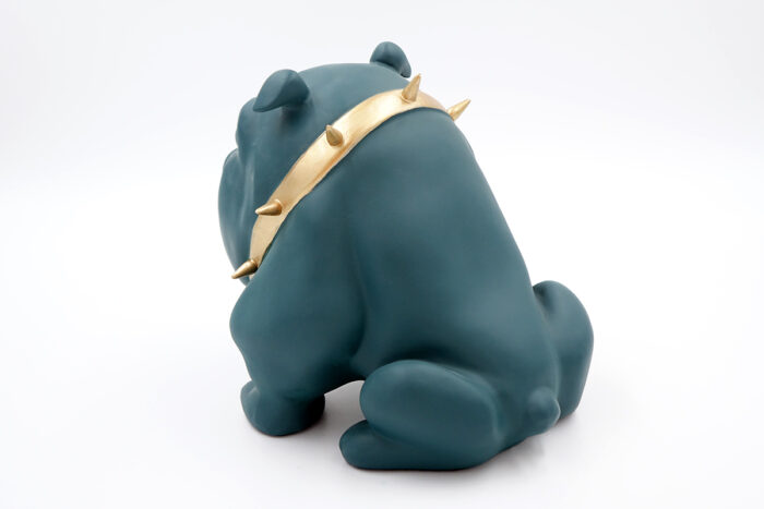 Dark green figurine of a bulldog with a golden spiked collar.