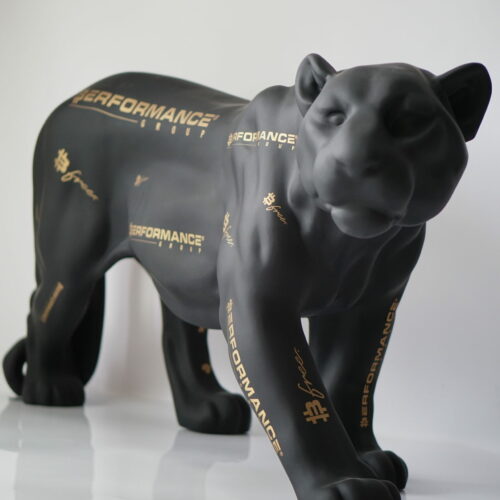 A black panther statue with gold