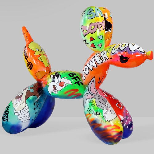 A colorful balloon dog sculpture decorated with graffiti-style art and cartoon characters.