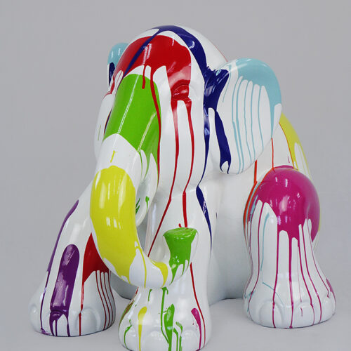 Colorful elephant sculpture with dripping paint effect.