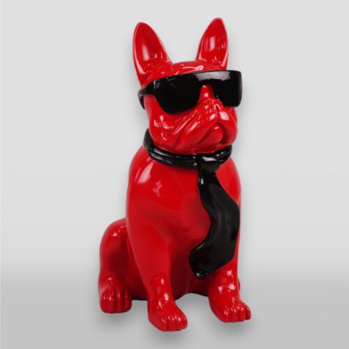 Red dog statue wearing black sunglasses and a black tie.