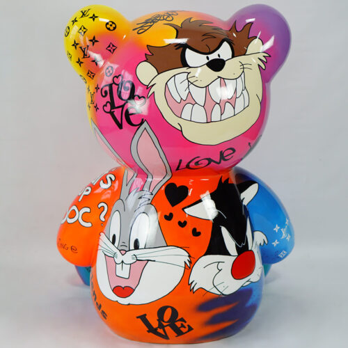 Colorful bear-shaped sculpture featuring cartoon characters and graffiti-style text.