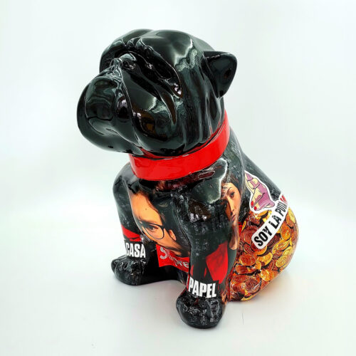 Black dog figurine with a red collar, featuring images and text related to 