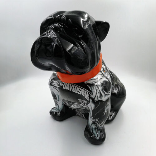 Black bulldog statue with an orange collar and Harley-Davidson logo on the body, against a plain white background.
