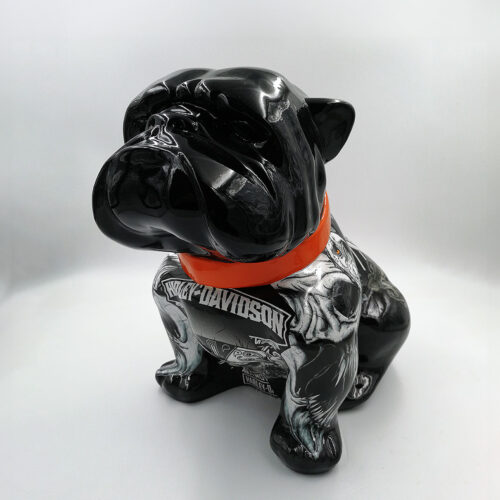 Statue of a black bulldog wearing an orange collar and featuring Harley-Davidson graphics.