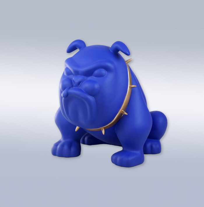 Blue bulldog statue wearing a gold spiked collar.