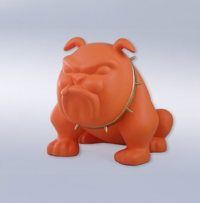 Orange cartoonish bulldog figurine with a spiked collar.