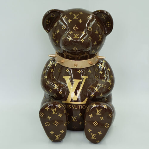 A statue of a teddy bear with the Louis Vuitton monogram logo and pattern.