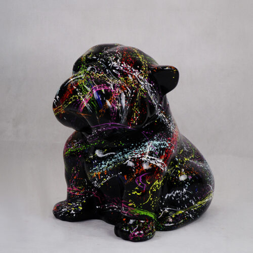 A black ceramic bulldog figurine with colorful splatter paint design.
