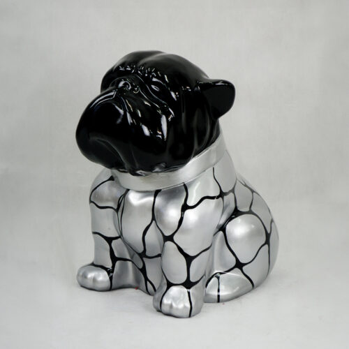 Statue of a dog with a shiny black head and a silver body with a black cracked pattern.