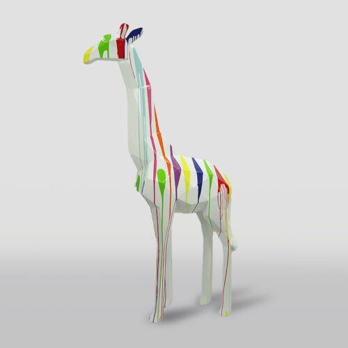 A colorful giraffe sculpture with a white base and multicolored paint drips covering its body.