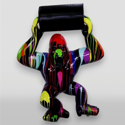 Colorful gorilla sculpture holding a black barrel.