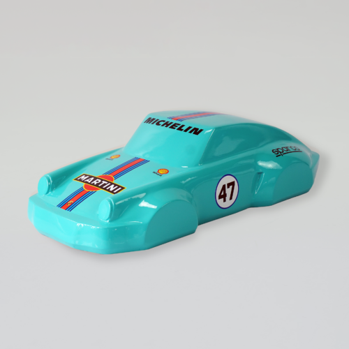 A turquoise toy car model with racing decals, including 