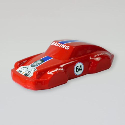 Red toy racing car with number 64, 