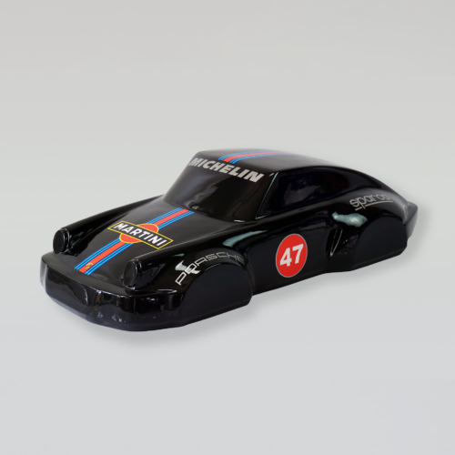 Black toy car with racing decals, including 
