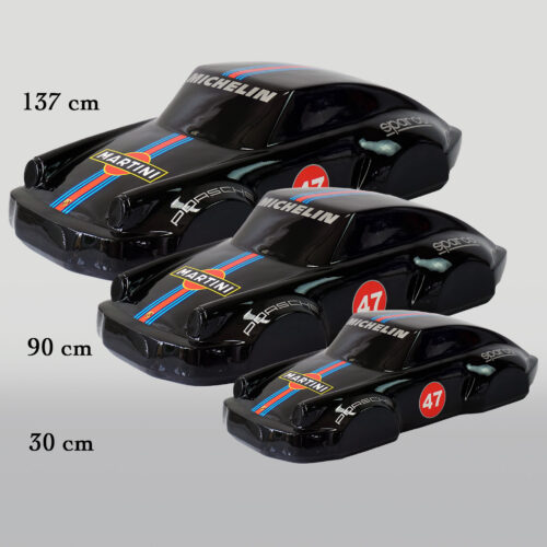Three black toy cars with blue and red stripes, labeled 