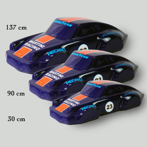 Three blue and orange toy race cars in different sizes with text displaying 