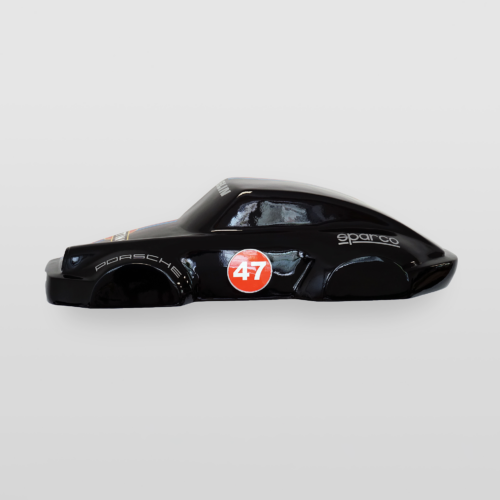Black toy car with a Porsche logo, number 47 in a red circle, and Sparco brand detailing.