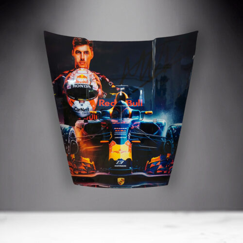 Decorated car hood featuring a Red Bull Formula 1 car with a portrait of a racing driver holding a helmet in the background.