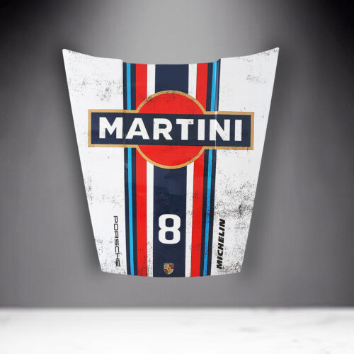 A car hood with Martini branding, featuring a red circle with a black background and white text. The hood is also adorned with blue, red, and white racing stripes, the number 8, and logos for Porsche and Michelin.