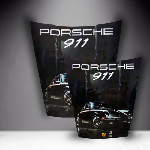 Two Porsche 911 car hoods with a sleek black finish, vintage Porsche 911 illustrations, and white 