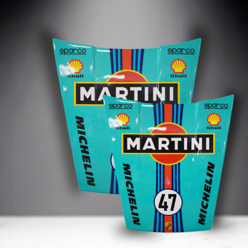 Two mint green racing car hoods with Martini, Shell, Sparco, and Michelin logos, adorned with blue and red racing stripes.