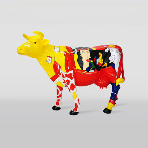 Colorful, painted cow sculpture with a yellow head and abstract designs in red, yellow, black, and white.