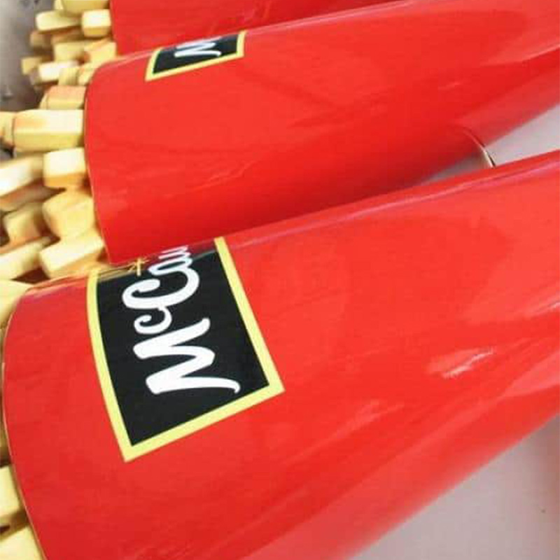 Red packaging cones filled with french fries, labeled with the McCain brand.