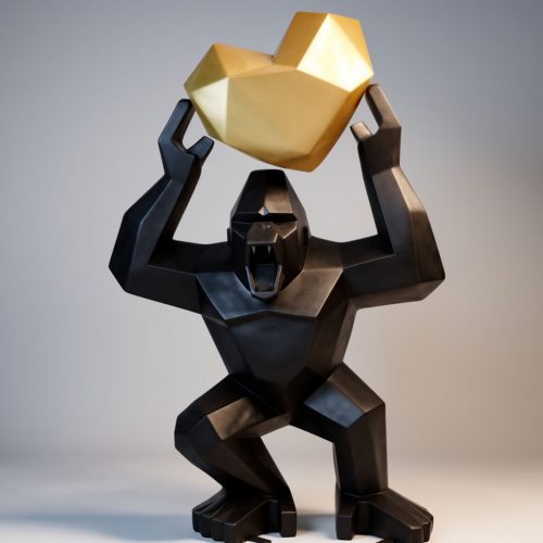 sculpture gorilla holding a faceted red heart, black glossy geometric fiberglass figure for decor or advertising