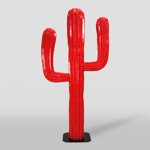 Red cactus-shaped sculpture on a black base.