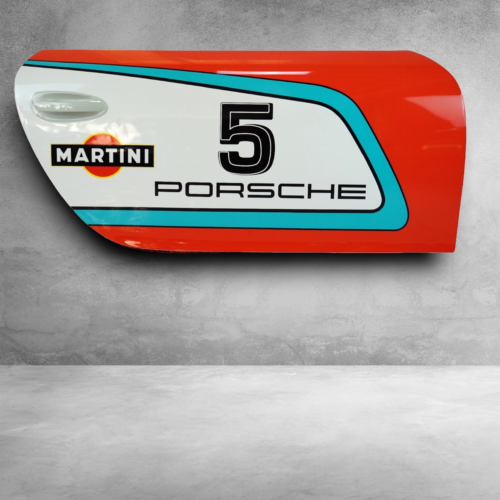 Red, white, and blue Porsche car door panel with the number 5, Martini logo, and Porsche text.