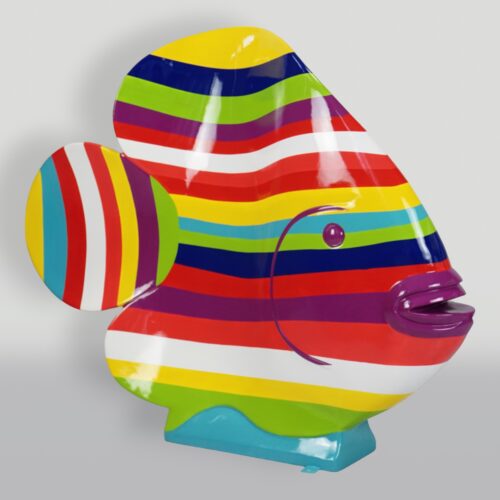 Colorful fish sculpture with horizontal stripes in red, orange, yellow, green, blue, and purple.