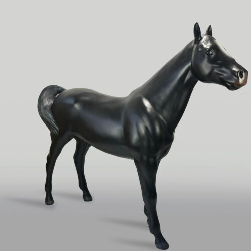 A shiny black horse sculpture posed on a neutral background.