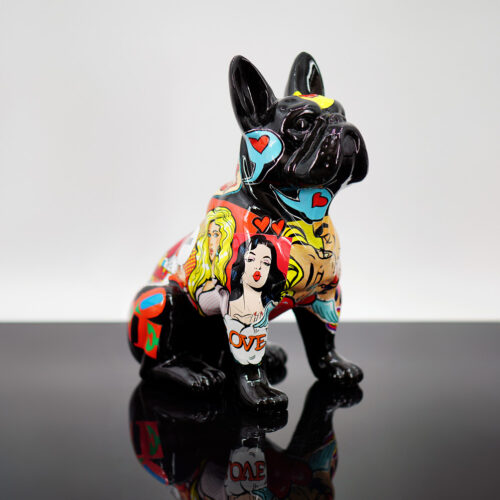 Colorful ceramic French Bulldog figurine with pop art designs on a reflective surface.
