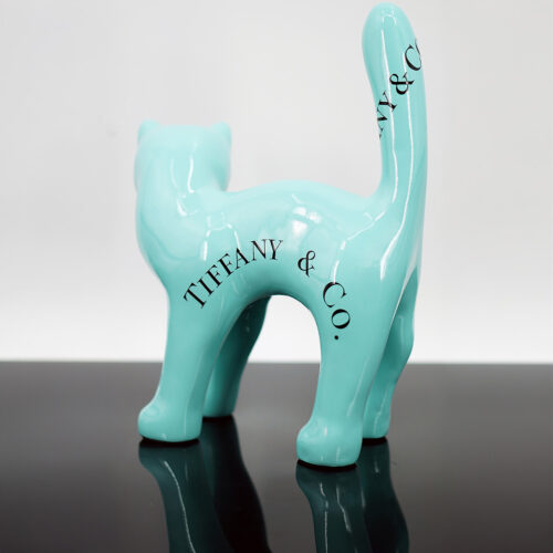 Turquoise ceramic cat statue with