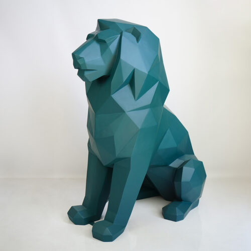 Green geometric lion statue on a white background.